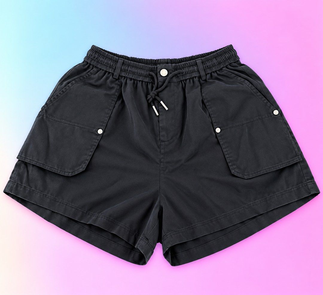 Kiabi Black Cargo Shorts Size XL (Category: Shorts) located in Quezon City. Submitted by turtleandfishes (Listing ID 1468675551, Image 1). Description: - Brand/Model: Kiabi Black Cargo Shorts - Size: XL - Waist: Approx. 15 inches across (with elastic waistband & drawstring) - Length: Approx. 19 inches total - Details: Button fly, front flap pockets with metal accents, and back pockets - Style: Casual everyday wear, easy to pair with tees and tank