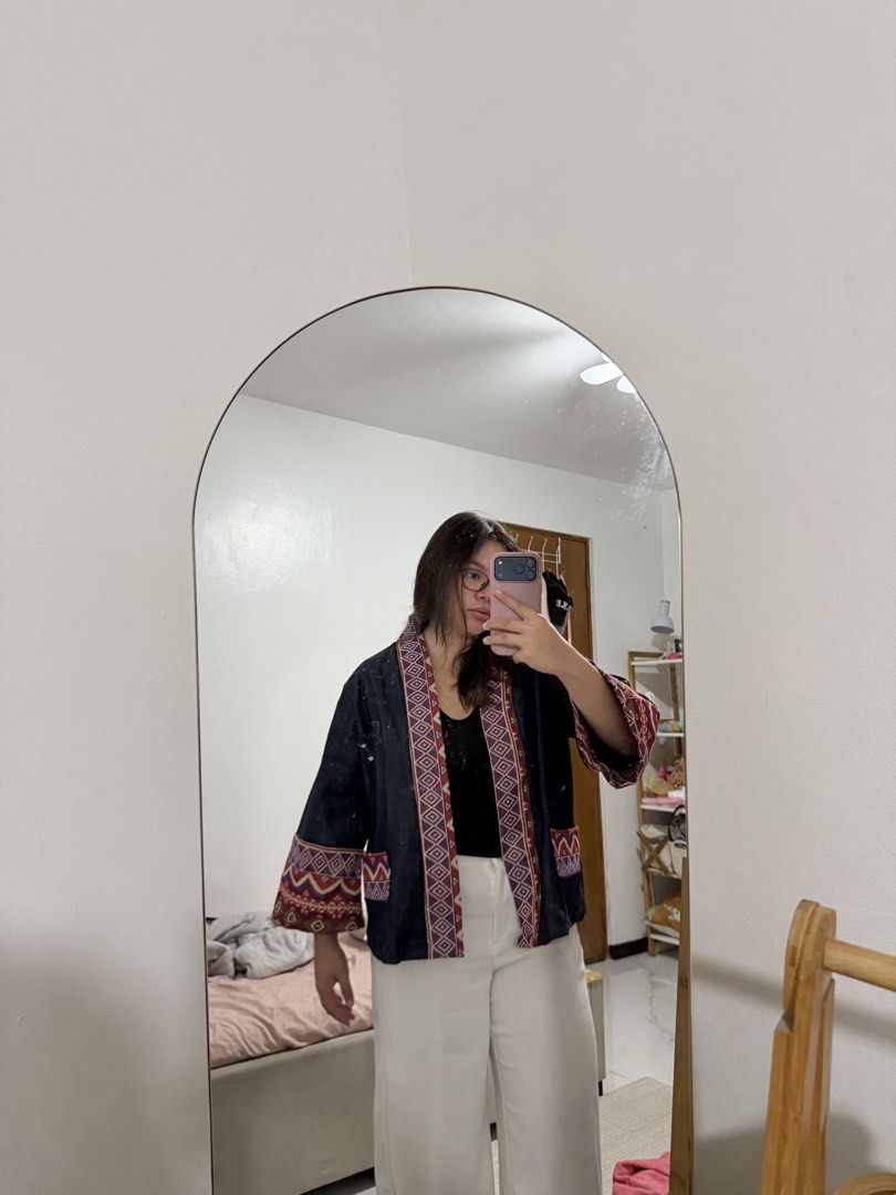 Kimono Cardigan (Category: Coats, Jackets and Outerwear) located in Paranaque City. Submitted by crysizzl (Listing ID 1468541371, Image 3). Description: - Color: Dark blue with multicolor ethnic/geometric prints - Design: Open-front kimono cardigan with front pockets - Details: Printed accents on the collar, cuffs, and pocket trims - Style: Casual, trendy, easy to layer - Condition: Well-maintained and ready to wear.