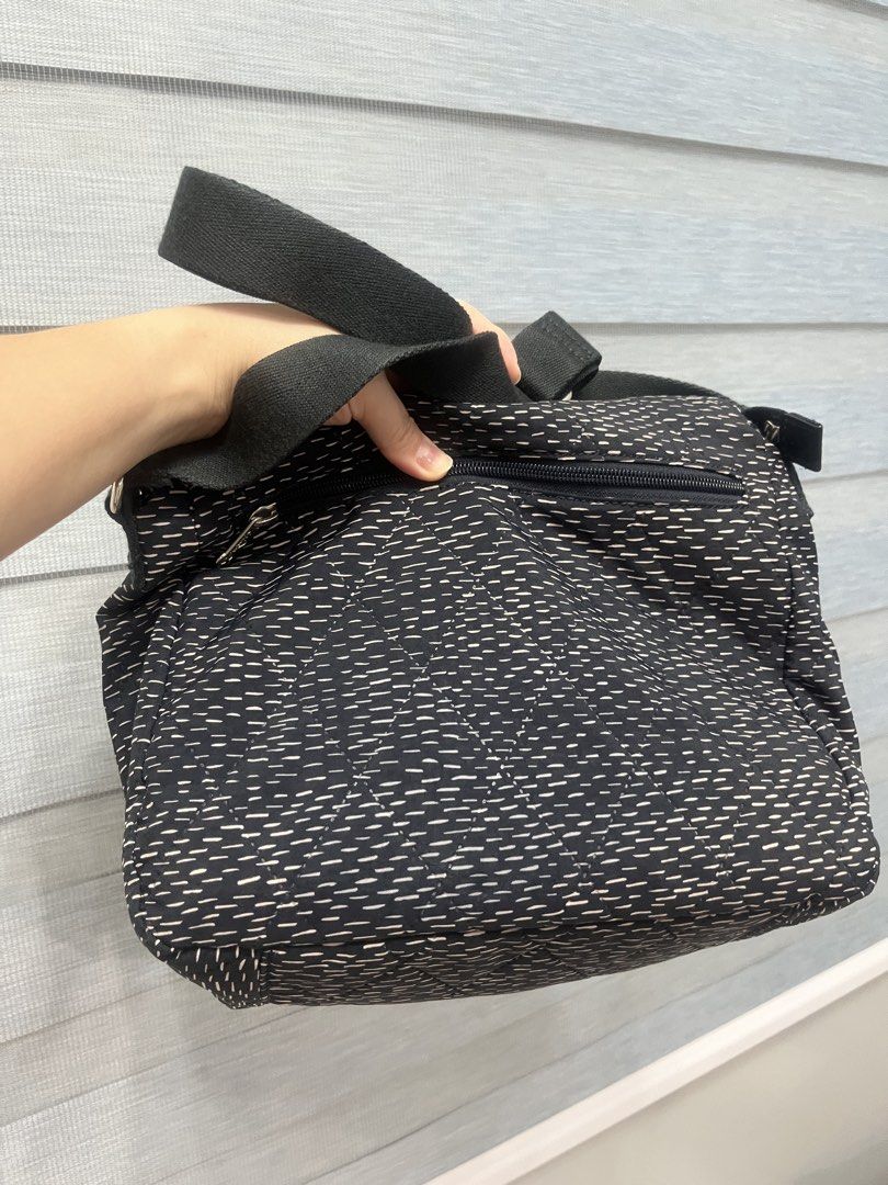 Kipling Gabbie Quilted Crossbody Shoulder Bag (Category: Cross-body Bags) located in Bulacan. Submitted by spring_cleaning_ (Listing ID 1468604093, Image 2). Description: - Brand: Kipling - Color: Black and white quilted - Style Code: K11273-79Q - Includes signature furry monkey keychain - Adjustable shoulder strap for a custom fit - Exterior zippered pocket for easy access - Patterned fabric interior lining with zip and slip compartments - Perfe