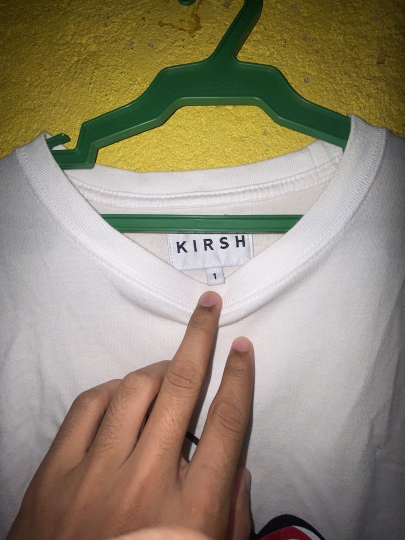 Kirsh Cherry White T-shirt Size 1 (Category: Shirts) located in Cagayan de Oro. Submitted by zekoy (Listing ID 1468626247, Image 3). Description: - Authentic Kirsh t-shirt in clean white - Features a large signature cherry graphic on the chest - Small embroidered cherry logo on the left sleeve - Crew neck and short sleeves - Size: 1 - Includes official authenticity tag near the hem.