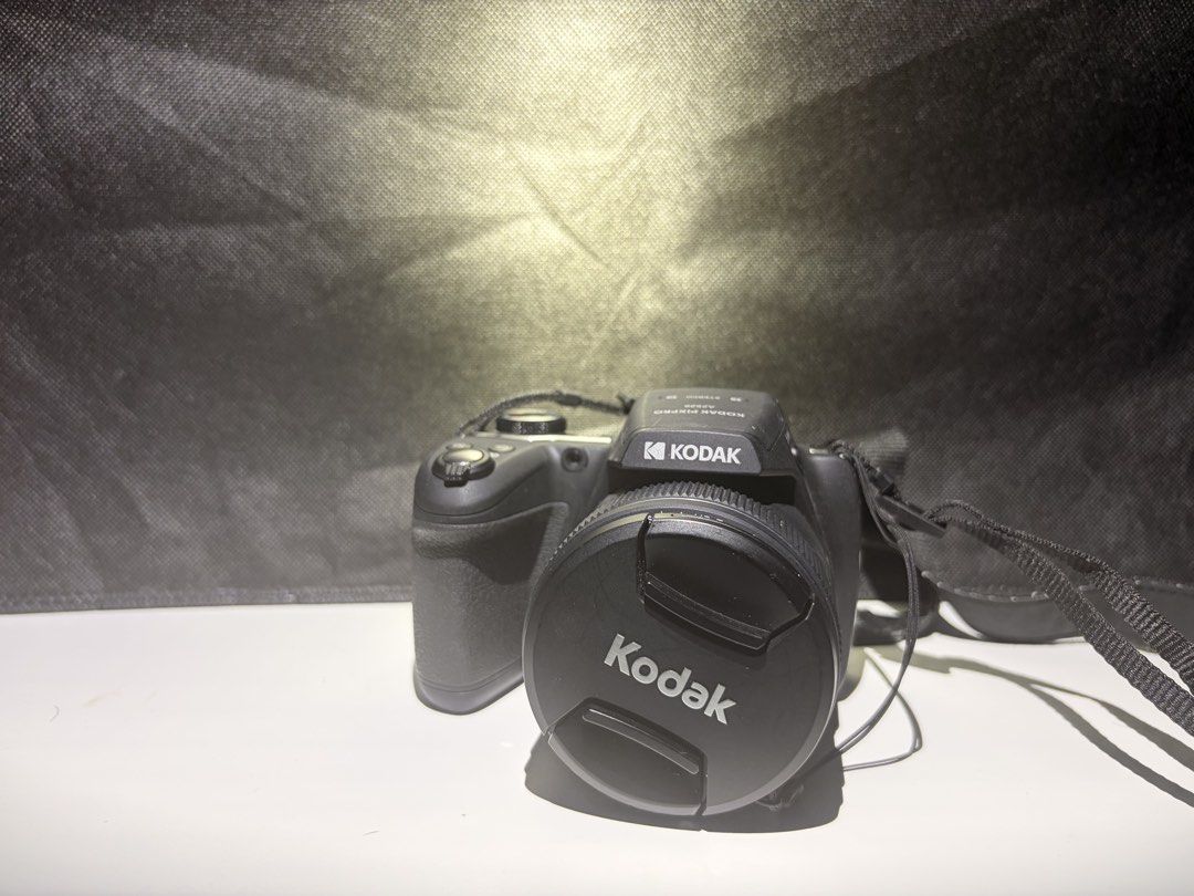Kodak Pixpro AZ528 Digital Camera with Box (Category: Cameras) located in Trece Martires City. Submitted by happyeagle_f4e905 (Listing ID 1468654683, Image 3). Description: - Model: Kodak Pixpro AZ528 Bridge Camera (Black) - Optics: 52x optical zoom with a 24mm wide-angle lens - Features: Built-in pop-up flash and ergonomic comfortable grip - Included: Neck strap, lens cap, and original yellow box - Condition: Camera handles great; box has minor 