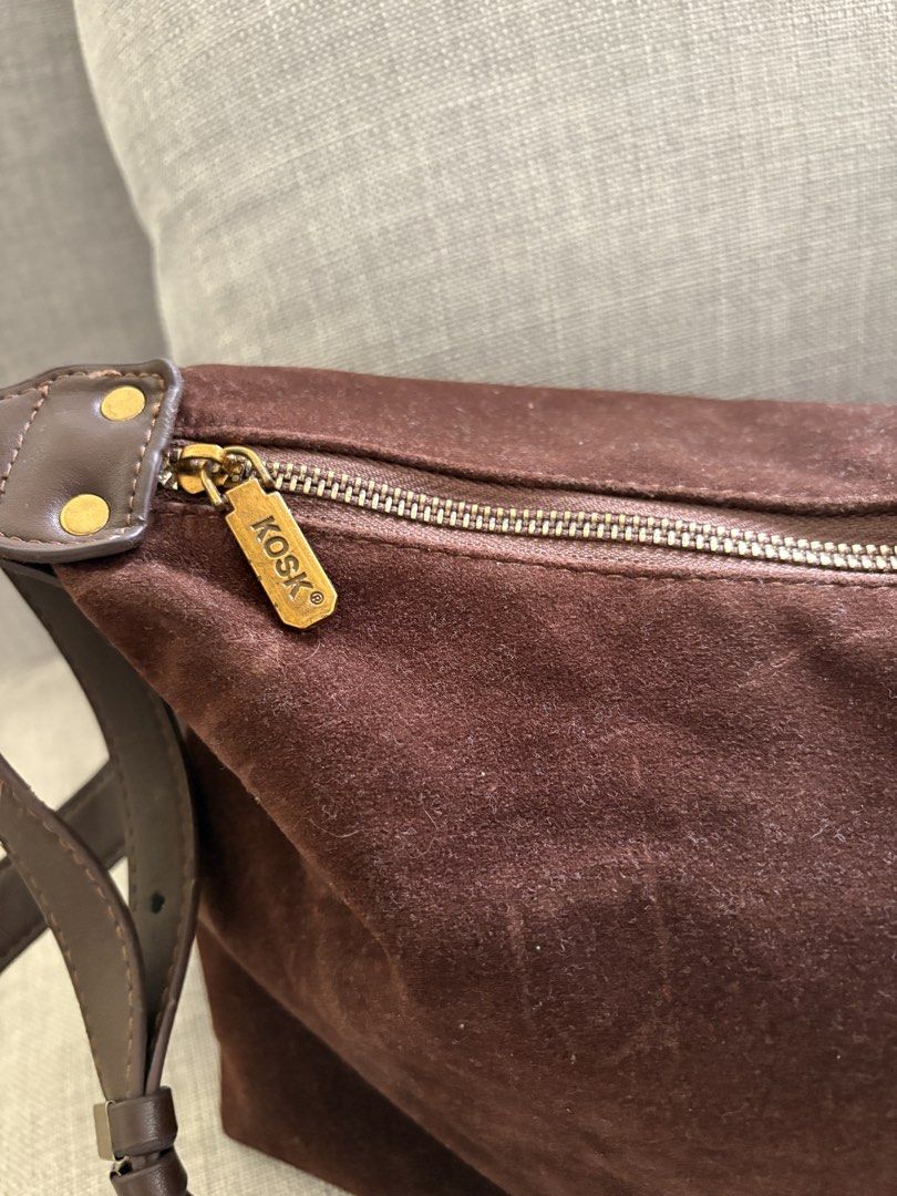 KOSK Brown Suede Shoulder Bag (Category: Shoulder Bags) located in Paranaque City. Submitted by craftywoobieph (Listing ID 1468541792, Image 2). Description: - Brand: KOSK Brand Leather - Material: Premium brown suede - Closure: Zip top with KOSK zipper pull - Hardware: Gold tone with adjustable leather strap - Interior: Clean beige lining with inner zip pocket and KOSK woven brand tag - Condition: Excellent, clean inside and out.