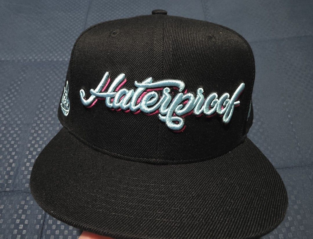 Krown Manila Haterproof Snapback Cap (Category: Caps & Hats) located in Santa Rosa. Submitted by rowhell09 (Listing ID 1468567073, Image 2). Description: Krown Manila Haterproof loonie cap brandnew 💸1650 MOD. LBC MOP. BDO, GCASH LOC. NUEVA ECIJA Meet up. Santa rosa Nueva Ecija - Color: Black with light blue and pink embroidery - Design: 'Haterproof' on the front, '100%' on the back - Fit: Adjustable plastic snap closure - Style: Flat brim snapba
