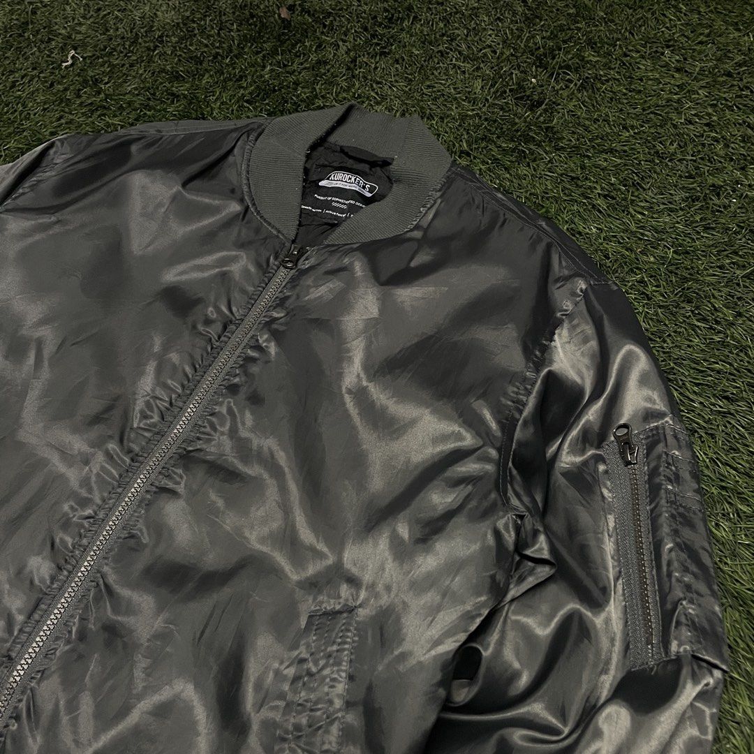 Kurocker’s Utility MA-1 Flight Bomber Jacket (Category: Coats, Jackets and Outerwear) located in Pasig City. Submitted by icie_finds (Listing ID 1468622808, Image 2). Description: Kurocker’s Utility MA-1 Flight Bomber Jacket SIZE: Tagged M (Fits Medium) DIMES: Width: 22.5 inches Length: 25.5 inches Style: Classic MA-1 utility flight bomber jacket featuring a satin shell, full front zip closure, ribbed trim, and sleeve utility zip pocket. Color: C