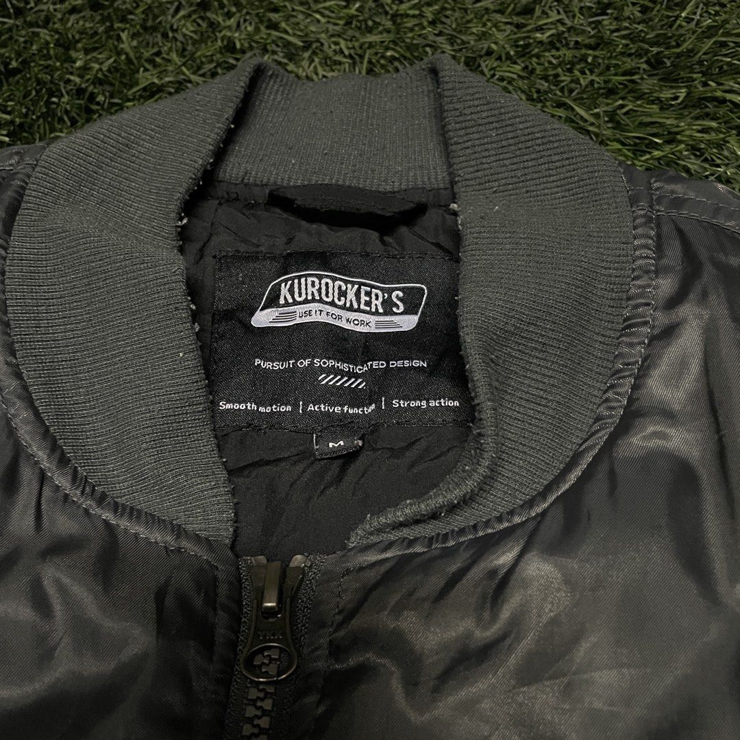 Kurocker’s Utility MA-1 Flight Bomber Jacket (Category: Coats, Jackets and Outerwear) located in Pasig City. Submitted by icie_finds (Listing ID 1468622808, Image 3). Description: Kurocker’s Utility MA-1 Flight Bomber Jacket SIZE: Tagged M (Fits Medium) DIMES: Width: 22.5 inches Length: 25.5 inches Style: Classic MA-1 utility flight bomber jacket featuring a satin shell, full front zip closure, ribbed trim, and sleeve utility zip pocket. Color: C