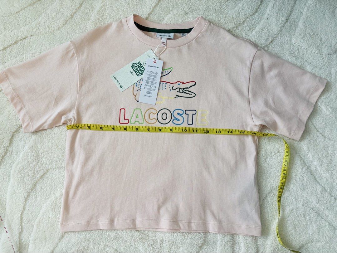 Lacoste (Category: Shirts) located in Lipa City. Submitted by klassique_handbags (Listing ID 1468575851, Image 3). Description: ✅Available✅ ❤️Lacoste❤️ Lacoste Kids’ / Girls’ Oversized Print Cotton T-Shirt Baby pink color (8 yrs old size small) 💯original🇱🇷 Sf not included courier Lbc📦 1800php Disclaimer: All trademarks, logos, and brand names mentioned or used in our products/services are the property of their respective owners. Any reference