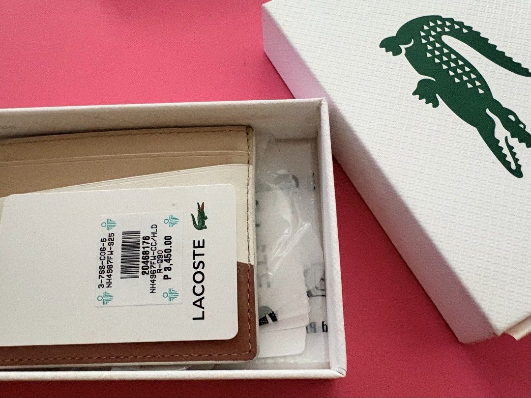 Lacoste Card Holder Cow Leather (Authentic) (Category: Wallets & Card holders) located in Quezon City. Submitted by rushcanon (Listing ID 1468529611, Image 3). Description: - With box and tags - Condition is 8/10 normal wears and tears for a cow leather product - 100% Authentic Lacoste card holder - Premium cow leather material - Chic multi-color design (beige, white, and brown panels) - Iconic embroidered crocodile logo on the front - Multiple c