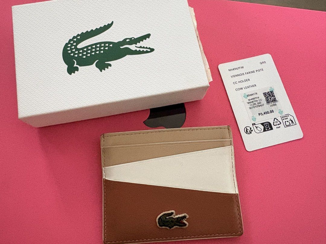 Lacoste Card Holder Cow Leather (Authentic) (Category: Wallets & Card holders) located in Quezon City. Submitted by rushcanon (Listing ID 1468529611, Image 1). Description: - With box and tags - Condition is 8/10 normal wears and tears for a cow leather product - 100% Authentic Lacoste card holder - Premium cow leather material - Chic multi-color design (beige, white, and brown panels) - Iconic embroidered crocodile logo on the front - Multiple c