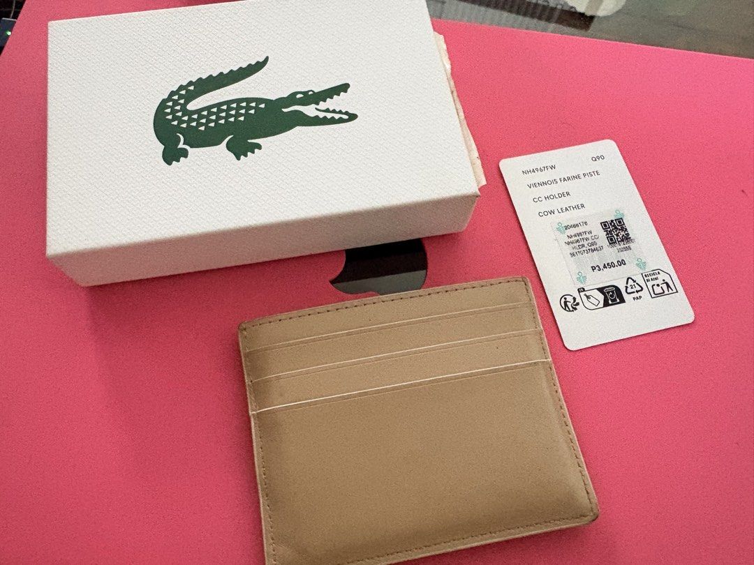 Lacoste Card Holder Cow Leather (Authentic) (Category: Wallets & Card holders) located in Quezon City. Submitted by rushcanon (Listing ID 1468529611, Image 2). Description: - With box and tags - Condition is 8/10 normal wears and tears for a cow leather product - 100% Authentic Lacoste card holder - Premium cow leather material - Chic multi-color design (beige, white, and brown panels) - Iconic embroidered crocodile logo on the front - Multiple c