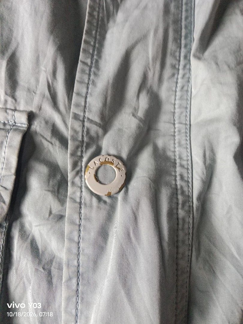 Lacoste Light Blue Hooded Jacket (Category: Coats, Jackets and Outerwear) located in Cabuyao City. Submitted by blake657 (Listing ID 1468711139, Image 3). Description: - Brand: Lacoste - Color: Light Blue - Size: 5 (Tag) - Origin: Designed in France, Made in Slovakia - Closure: Front button closure - Pockets: Multiple functional pockets - Condition: Good everyday outerwear piece.