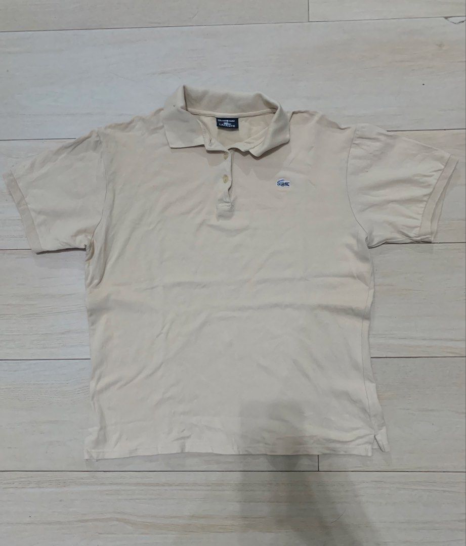 Lacoste Limitée Silver Polo Shirt Cream (Category: Tshirts & Polo Shirts ) located in Manila. Submitted by thrifty111 (Listing ID 1468620734, Image 1). Description: - Brand: Lacoste (Limitée Silver Collection) - Size: 50 - Color: Cream - Material: Classic pique cotton knit - Details: Embroidered chest logo, large lettering on back collar, branded buttons - Fit: Short sleeves, easy to style with jeans or shorts -size 20.5x25.