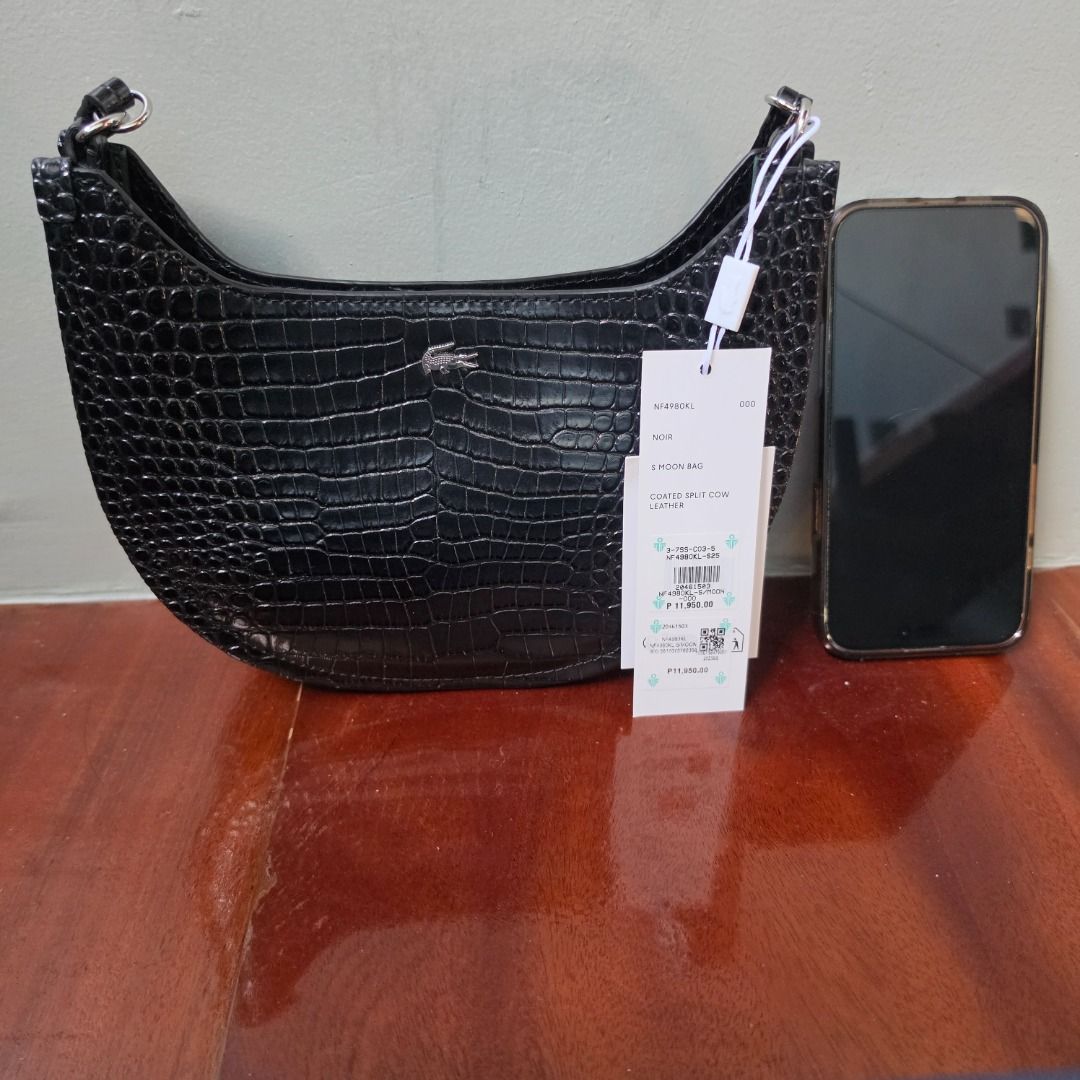 LACOSTE Small Chantaco Embossed Leather Half Moon Bag (Category: Cross-body Bags) located in Las Pinas. Submitted by my_opencloset (Listing ID 1468602175, Image 3). Description: - Brand new with store tag attached (P11,950) - 30% off from original price - With Lacoste Paperbag - With Lacoste Dustbag Size reference in pictures : Iphone 16 Promax.