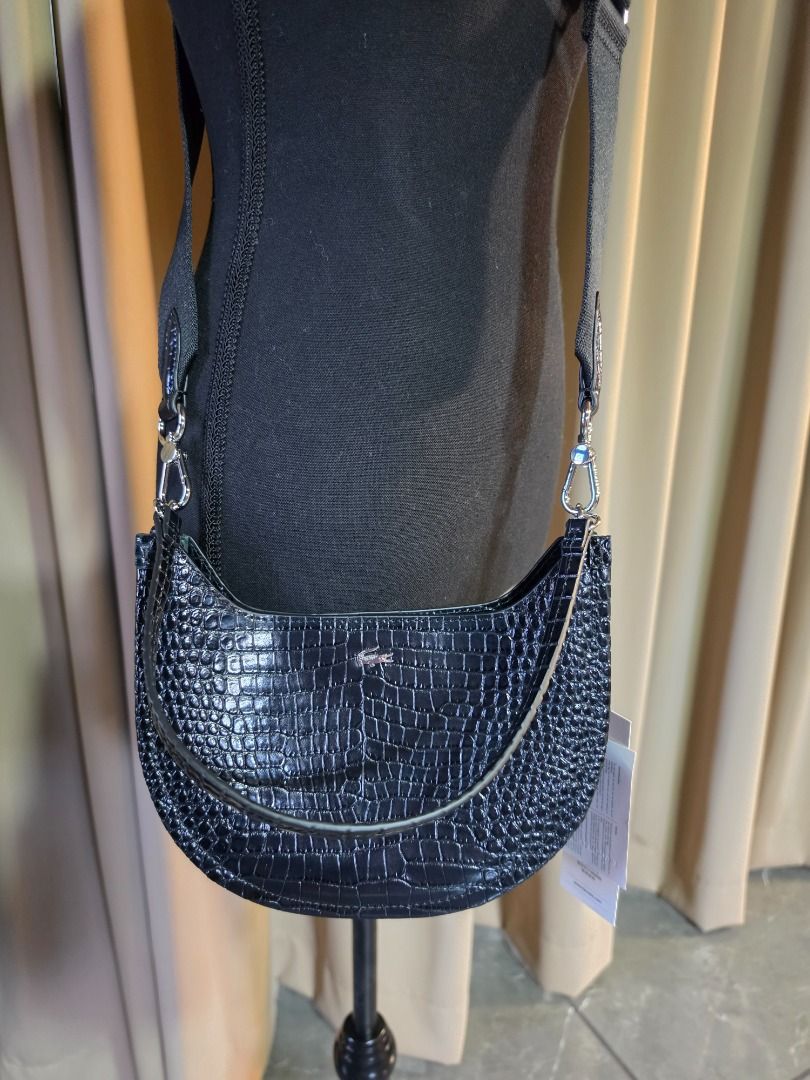 LACOSTE Small Chantaco Embossed Leather Half Moon Bag (Category: Cross-body Bags) located in Las Pinas. Submitted by my_opencloset (Listing ID 1468602175, Image 1). Description: - Brand new with store tag attached (P11,950) - 30% off from original price - With Lacoste Paperbag - With Lacoste Dustbag Size reference in pictures : Iphone 16 Promax.