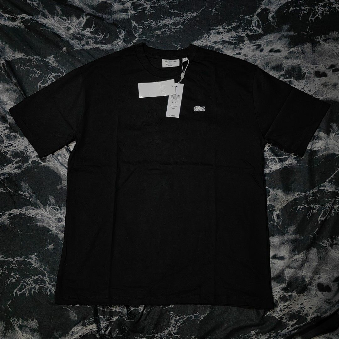 Lacoste Tshirt (Category: Activewear) located in Taguig. Submitted by mr.gbh (Listing ID 1468588375, Image 2). Description: Lacoste Basic Logo Tee Black Size: Medium To Large L-29/W-22 Excellent Condition Php, 699.