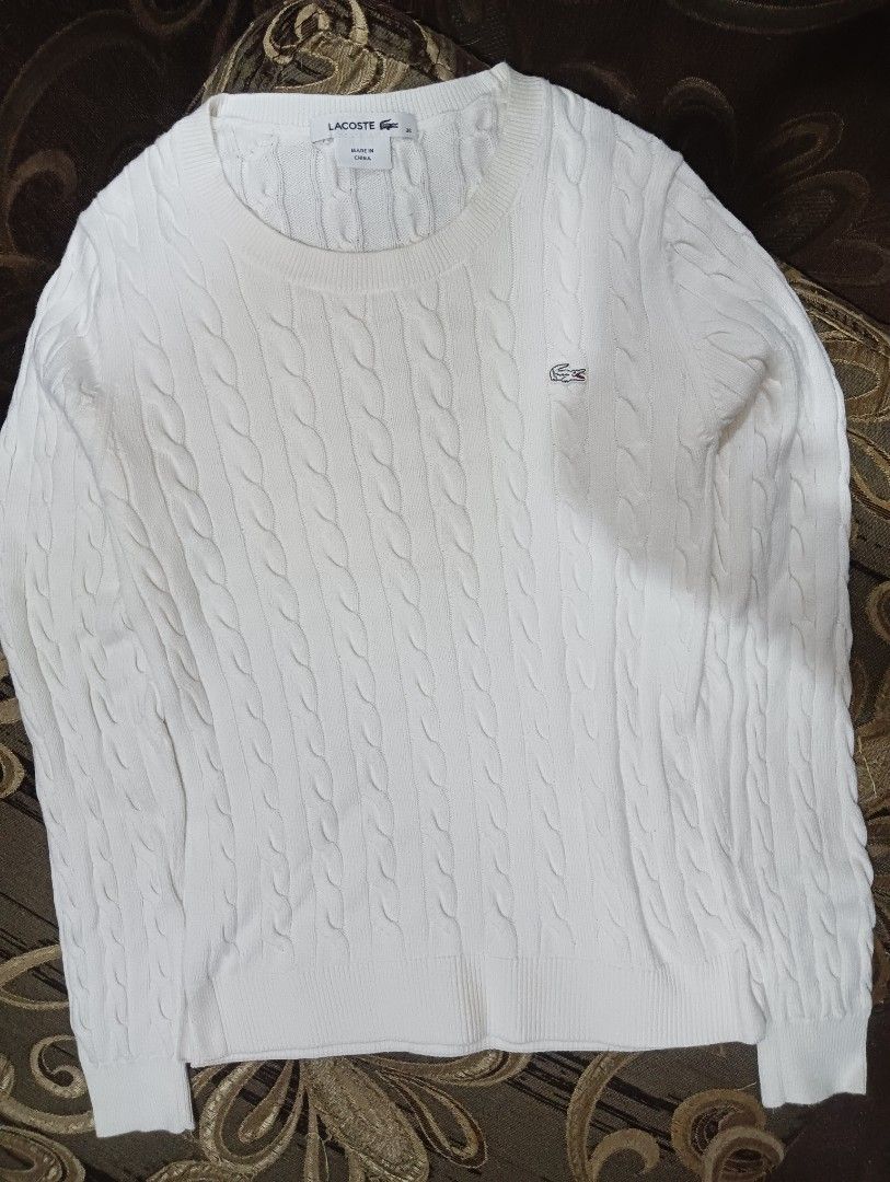 Lacoste White Cable Knit Sweater (Category: Longsleeves) located in Manila. Submitted by adriane.s_lootz (Listing ID 1468651187, Image 2). Description: DIMES : WIDTH 17. LENGTH 23 - Brand: Lacoste - Style: Cable knit sweater - Color: Classic White - Size: 36 (fits S to M) - Material: 100% Cotton EXCELLENT CONDITION NO FLAWS .
