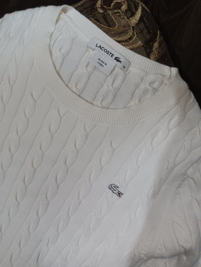 Lacoste White Cable Knit Sweater (Category: Longsleeves) located in Manila. Submitted by adriane.s_lootz (Listing ID 1468651187, Image 1). Description: DIMES : WIDTH 17. LENGTH 23 - Brand: Lacoste - Style: Cable knit sweater - Color: Classic White - Size: 36 (fits S to M) - Material: 100% Cotton EXCELLENT CONDITION NO FLAWS .