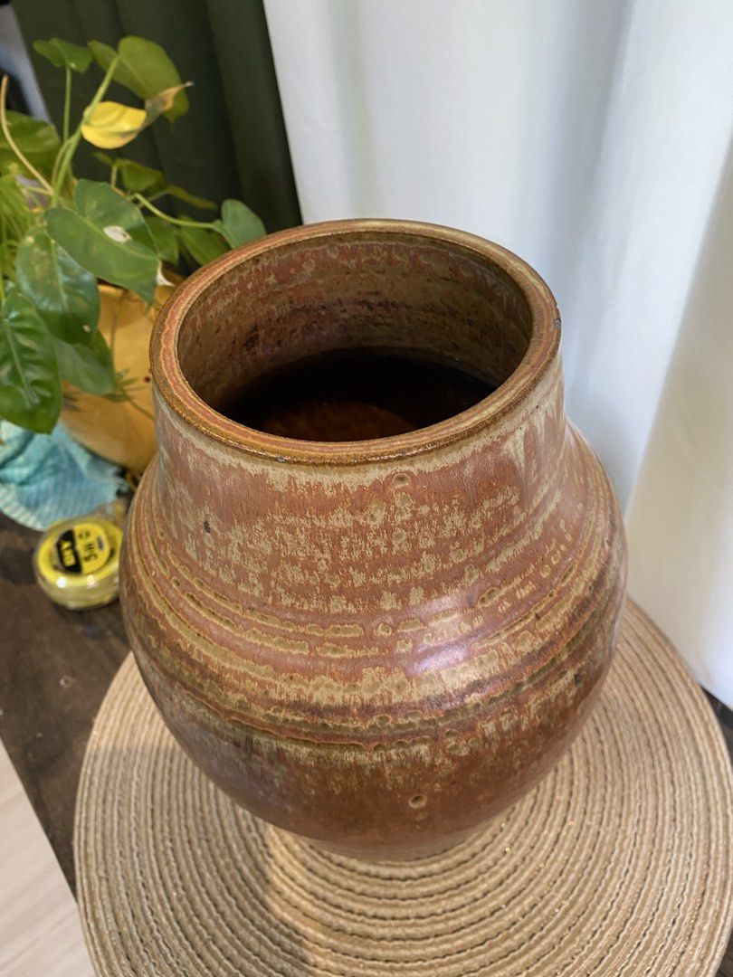 Large Brown Ceramic Vase Handcrafted Pottery Decor (Category: Vases & Decorative Bowls) located in San Pedro. Submitted by jingay81 (Listing ID 1468708744, Image 3). Description: - Handcrafted ceramic vase with textured brown and tan glaze - Features subtle incised ridges and a wide cylindrical opening - Stands approx. 11 inches tall with a sturdy, heavy stoneware base - Ideal for dried florals or as a standalone statement piece.