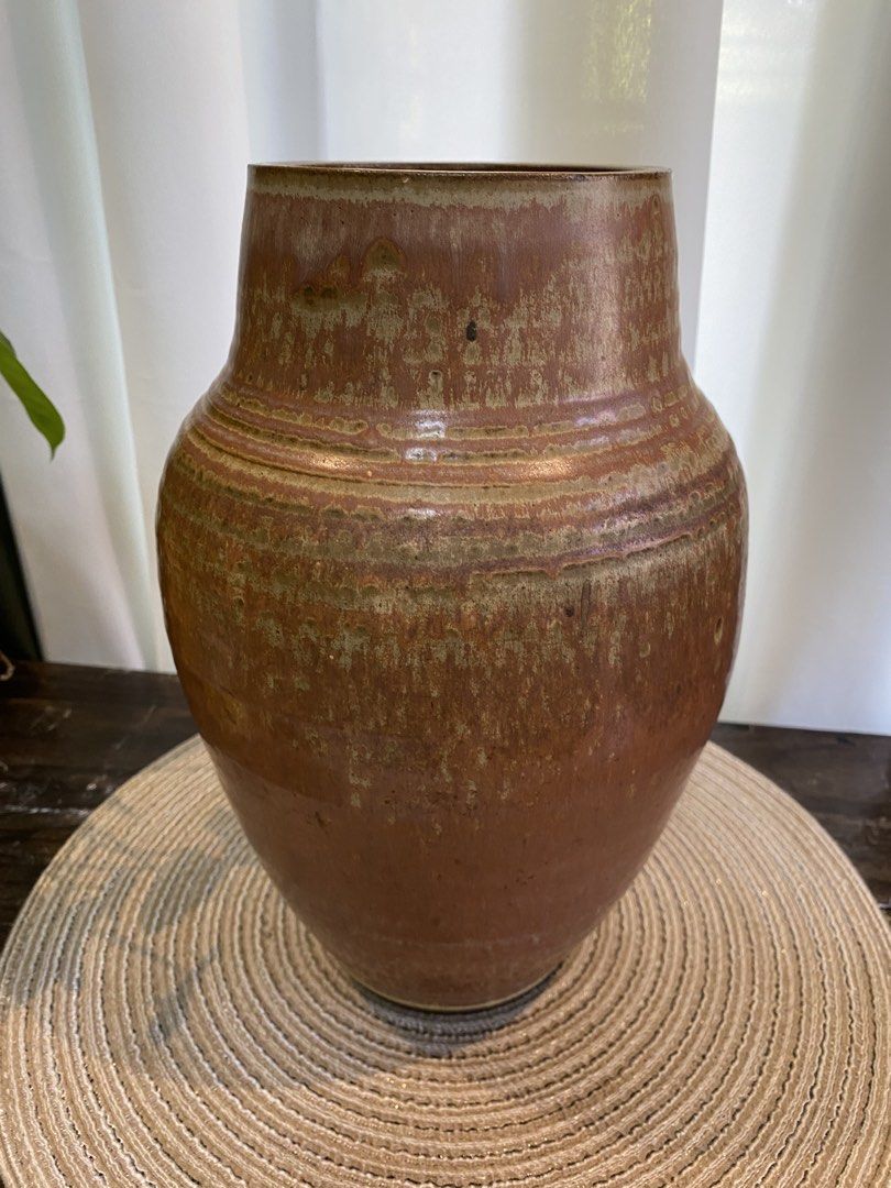 Large Brown Ceramic Vase Handcrafted Pottery Decor (Category: Vases & Decorative Bowls) located in San Pedro. Submitted by jingay81 (Listing ID 1468708744, Image 1). Description: - Handcrafted ceramic vase with textured brown and tan glaze - Features subtle incised ridges and a wide cylindrical opening - Stands approx. 11 inches tall with a sturdy, heavy stoneware base - Ideal for dried florals or as a standalone statement piece.