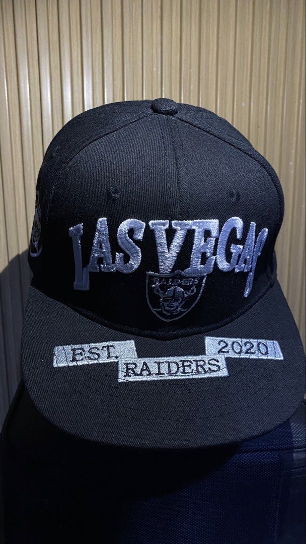 Las Vegas Raiders Closecap Hat Size 7 (Category: Caps & Hats) located in Manila. Submitted by _kyndzgrt (Listing ID 1468682207, Image 3). Description: - Authentic Black Las Vegas Raiders snapback cap - Size 7 tag included - Features embroidered Las Vegas lettering and iconic Raiders shield logo on the front - Brim detailed with 'Est. 2020 Raiders' embroidery - Side panel includes an official Raiders shield patch - Structured fit with a flat brim 