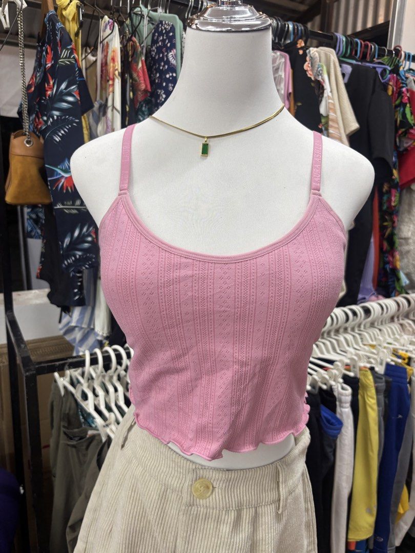 Laura Ashley floral crop top bundle set (Category: Sleeveless) located in Alicia. Submitted by thriftbagph (Listing ID 1468636694, Image 2). Description: - Set of 3 trendy and comfy ribbed crop tops - Features lettuce hem finishes on all pieces - Includes white floral print short-sleeve top - Includes solid pink cami with strap text - Includes white cami with a cute chest rose brooch - Perfect for casual days out and everyday styling - Super comf