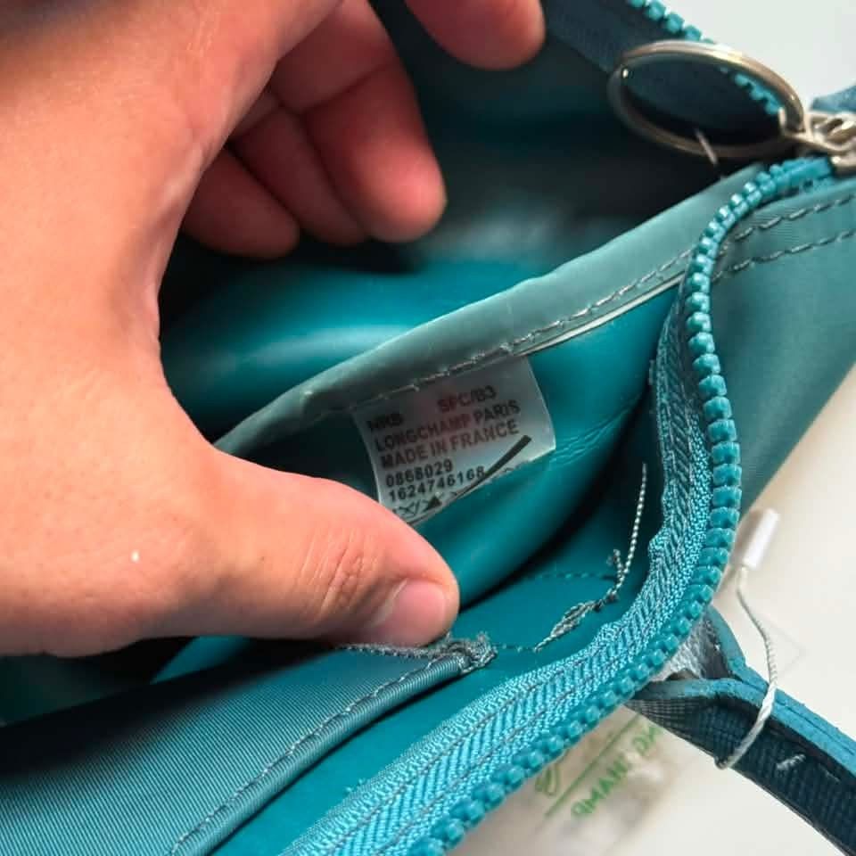 LC handbag (Category: Purses & Pouches) located in Manila. Submitted by mamapards17 (Listing ID 1468591279, Image 3). Description: teal-colored Longchamp Le Pliage-style short-handle handbag with a leather flap and snap closure..