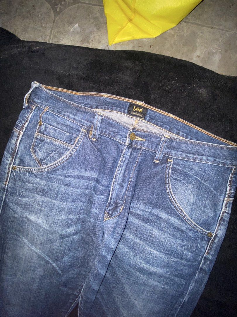 Lee Denim Jeans Blue (Category: Jeans) located in Cagayan de Oro. Submitted by zekoy (Listing ID 1468626016, Image 2). Description: - Brand: Lee - Color/Wash: Blue mid-wash with natural fading patterns - Closure: Button fly with belt loops - Pockets: Classic front, coin, and back pockets - Details: Signature leather back patch - Condition: Excellent, ready to wear.