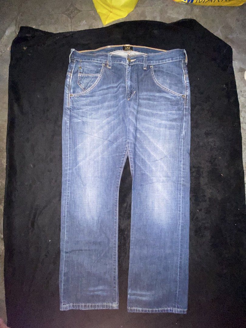 Lee Denim Jeans Blue (Category: Jeans) located in Cagayan de Oro. Submitted by zekoy (Listing ID 1468626016, Image 1). Description: - Brand: Lee - Color/Wash: Blue mid-wash with natural fading patterns - Closure: Button fly with belt loops - Pockets: Classic front, coin, and back pockets - Details: Signature leather back patch - Condition: Excellent, ready to wear.