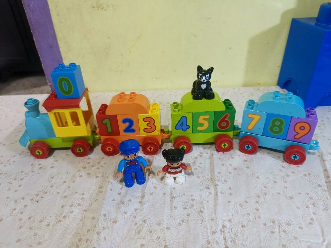 LEGO DUPLO My First Number Train 10847 (Category: Lego & Building Sets) located in Caloocan City. Submitted by mckysprelove (Listing ID 1468656190, Image 2). Description: - Colorful building train set for toddlers learning numbers 0 to 9 - Includes blue engine, number block carriages, black cat, and two child figures - Complete set with all pieces shown in photos - Clean item from a smoke-free and pet-free home -LOCATION Balagtas Bulacan SPX OR L