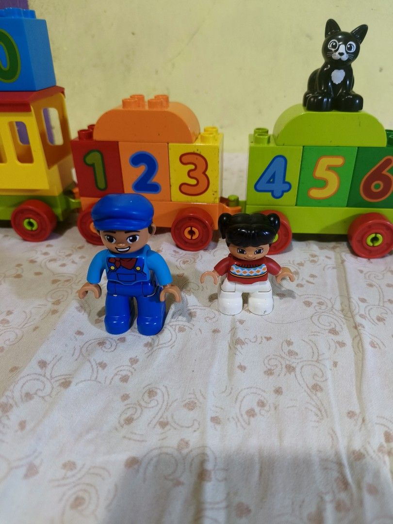 LEGO DUPLO My First Number Train 10847 (Category: Lego & Building Sets) located in Caloocan City. Submitted by mckysprelove (Listing ID 1468656190, Image 3). Description: - Colorful building train set for toddlers learning numbers 0 to 9 - Includes blue engine, number block carriages, black cat, and two child figures - Complete set with all pieces shown in photos - Clean item from a smoke-free and pet-free home -LOCATION Balagtas Bulacan SPX OR L
