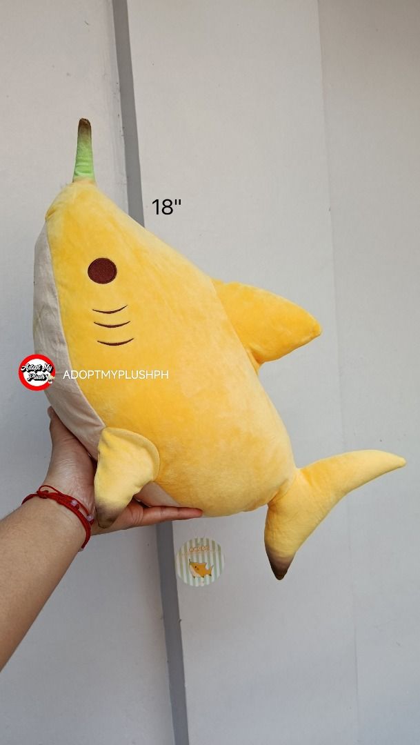 18" Leonardo Banana Shark Plush (Category: Plushies & Soft Toys) located in Taguig. Submitted by adopt.my.plush.ph (Listing ID 1468540400, Image 3). Description: Leonardo Big Shark Plush Toy 2 Fruit Version • Design: Banana fruit version with a yellow body, brown gills, and a green banana stem horn/tip • Size: Approximately 45 cm to 48 cm (roughly 18 inches) in length • Origin: Originally released as a Japanese claw machine / arcade prize (amusem