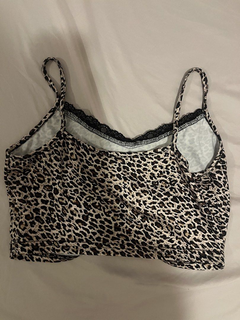 Leopard Print Crop Top with Black Lace Trim (Category: Sleeveless) located in Manila. Submitted by vees.shop (Listing ID 1468682077, Image 2). Description: - Trendy leopard print crop top with thin spaghetti straps - Features chic black lace trim along the neckline - Soft and stretchy material for a comfortable fit - Easy to style with high-waisted jeans or skirts.