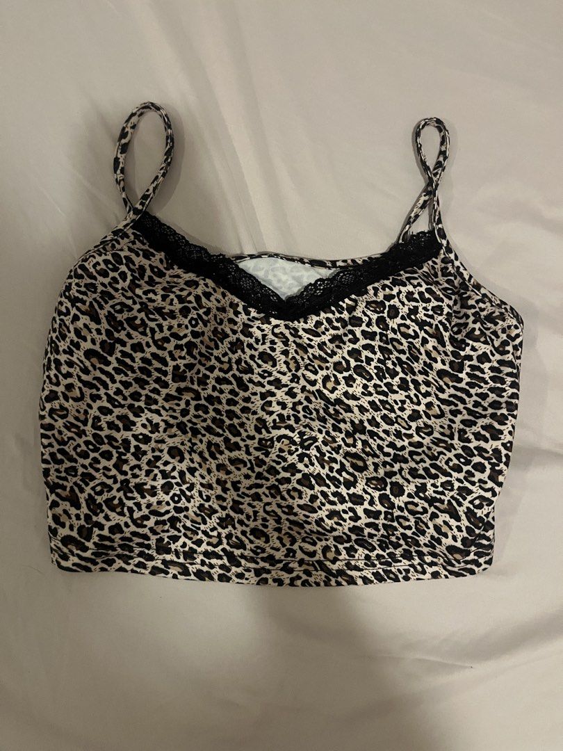 Leopard Print Crop Top with Black Lace Trim (Category: Sleeveless) located in Manila. Submitted by vees.shop (Listing ID 1468682077, Image 1). Description: - Trendy leopard print crop top with thin spaghetti straps - Features chic black lace trim along the neckline - Soft and stretchy material for a comfortable fit - Easy to style with high-waisted jeans or skirts.