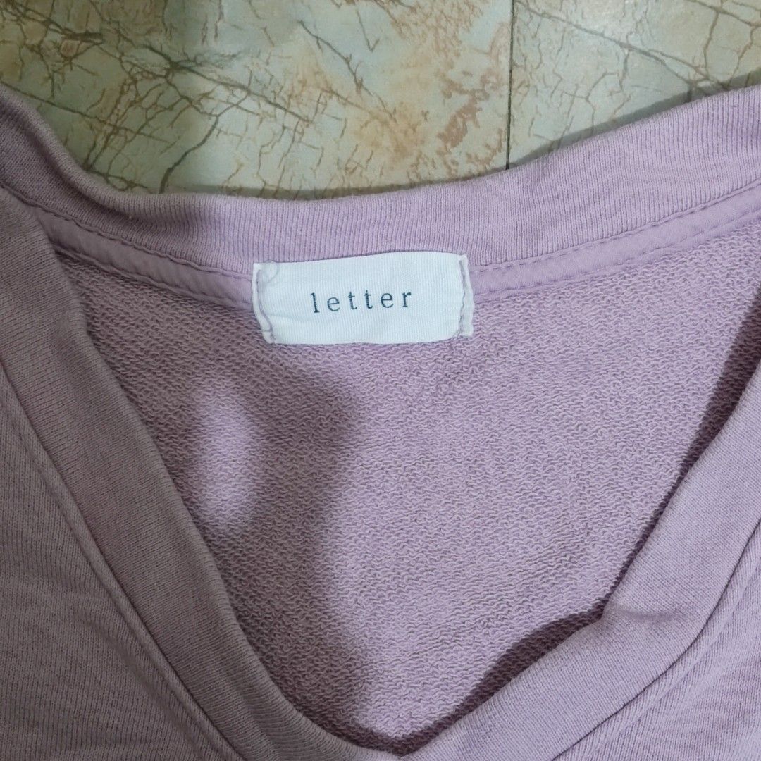 Letter Lavender V-Neck Sweatshirt (Category: Coats, Jackets and Outerwear) located in Valenzuela. Submitted by 0003c4 (Listing ID 1468676531, Image 3). Description: fits xs to small. needs some ironing :) superrr nice fabric!! has a very tiny hole at the back part, but almost not noticeable location: Valenzuela mod: lalamove or jnt.