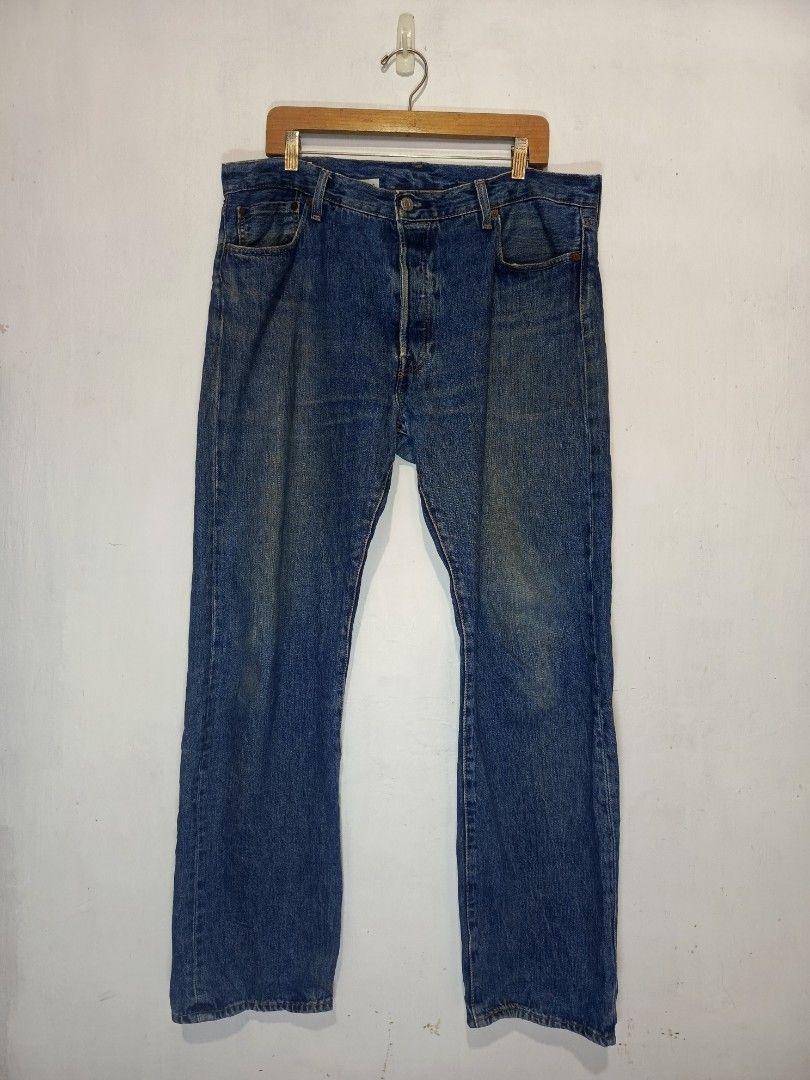 LEVI'S 501 BUTTON FLY BIG E PANTS (Category: Jeans) located in Baguio. Submitted by 074thriftmania (Listing ID 1468601967, Image 1). Description: Classic Levi's 501 jeans in a medium blue wash. Straight leg cut with standard five-pocket styling and button fly. Genuine leather waist patch on the back, red tab on the rear pocket, and inner Levi's Premium label. Tagged size W36 L32. Hand-measured tape notes actual waist 36-38 inches and length 42 in