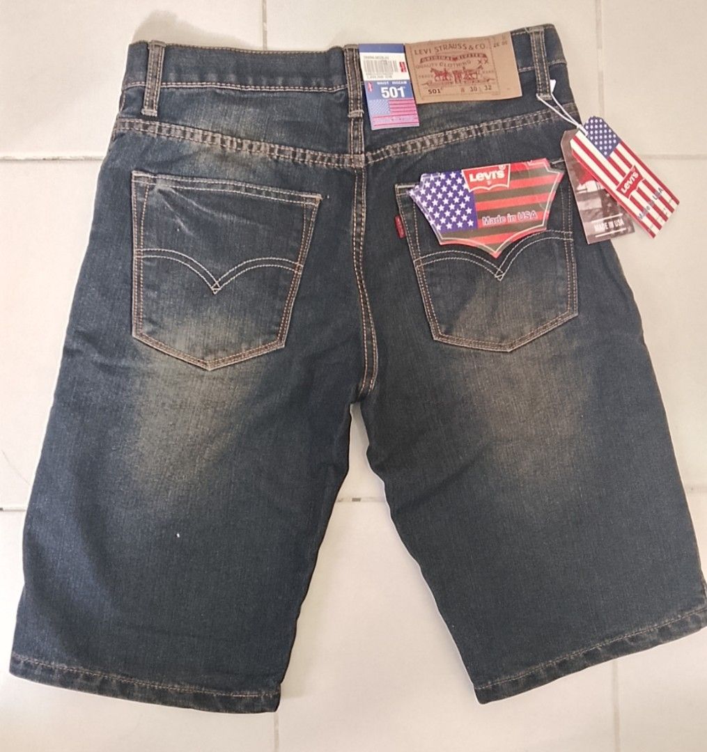 Levi's 501 Denim Shorts Size 30 (Category: Shorts) located in Caloocan City. Submitted by tamonchi (Listing ID 1468589817, Image 2). Description: - Brand: Levi's 501 - Style: Dark wash denim shorts with button fly and five-pocket styling - Condition: Brand new with original tags and paper waist patch attached - Size: Waist 30, Length 32 - Extras: Includes classic American flag pocket insert - Authenticity: 100% unworn and pristine.