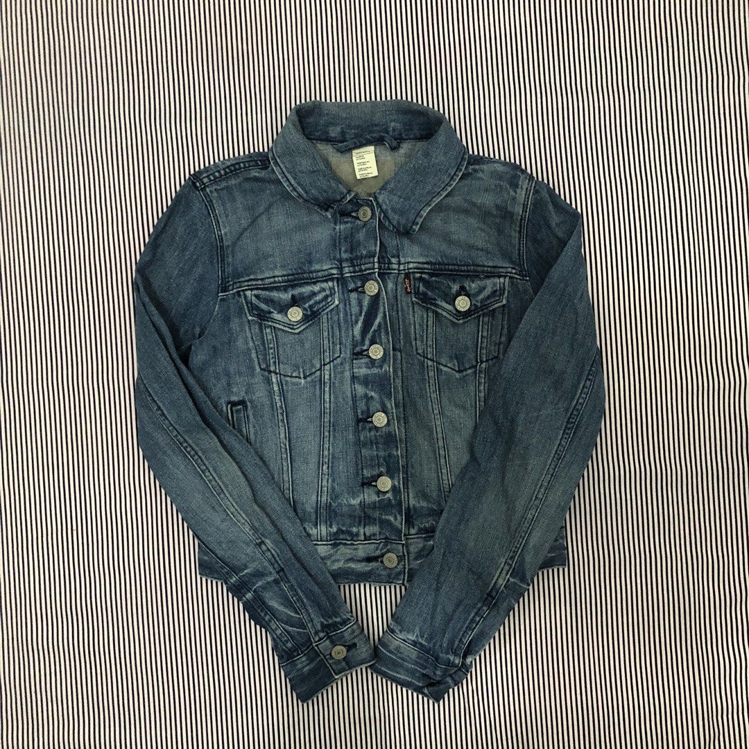 Levi's Denim Jacket Medium Wash (Category: Coats, Jackets and Outerwear) located in Angeles City. Submitted by gray_thrift8 (Listing ID 1468559657, Image 1). Description: Dimensions: 17 width 19.5 length 24 sleeves Issue: Stains Need wash Pm!.