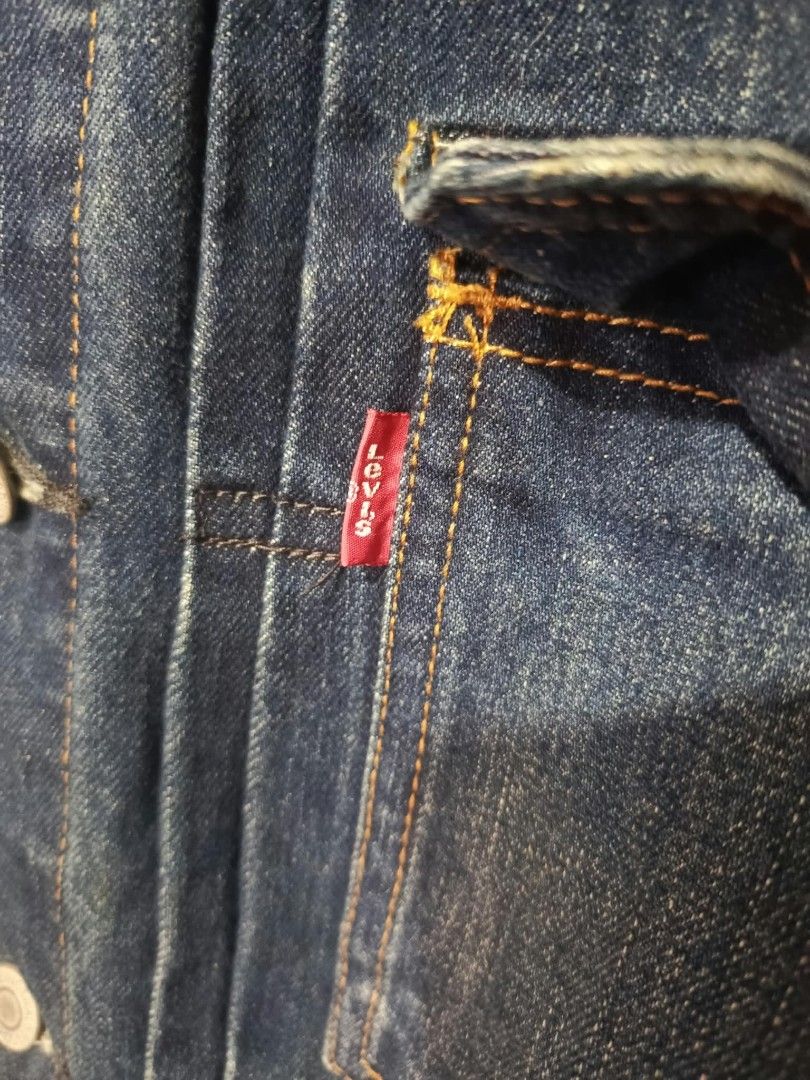 Levi's Distressed Denim Jacket Size M Slim Fit (Category: Coats, Jackets and Outerwear) located in Baguio. Submitted by miisthyshop.ph (Listing ID 1468528405, Image 3). Description: - Brand: Levi's - Style: Slim fit denim jacket with distressed details and front rips - Color: Dark wash blue - Size: Men's Medium (Tag: 170/88A) - Material: 100% Cotton - Details: Metallic button-up closure, standard collar, button cuffs, and classic red tab - Origin