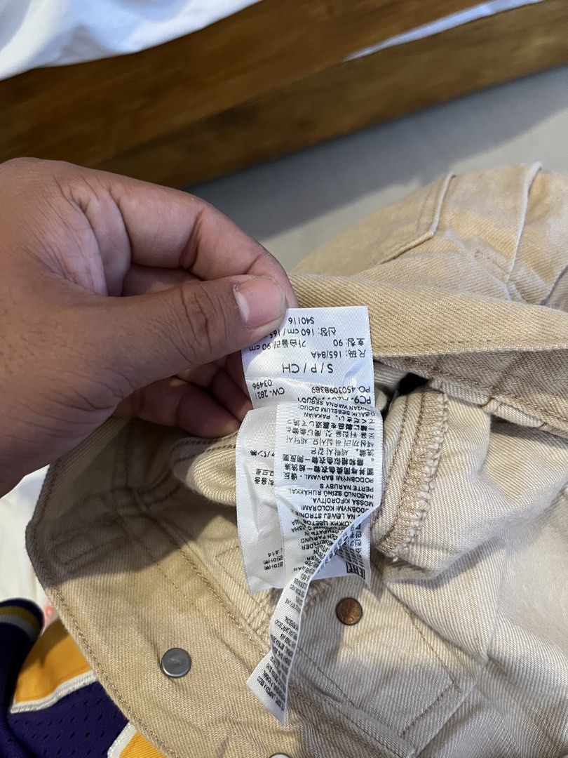 Levi's Red Beige Denim Jacket Size S (Category: Coats, Jackets and Outerwear) located in Quezon City. Submitted by reluxefinds2025 (Listing ID 1468510654, Image 3). Description: - Brand: Levi's Red - Color: Beige - Size: S (Tag: 165/84A / 160 cm) - Material: Denim - Design: Button-up front with classic collar and multiple front pockets - Details: Signature red leather brand patch inside the collar - Origin: Made in China - Condition: Excellent.