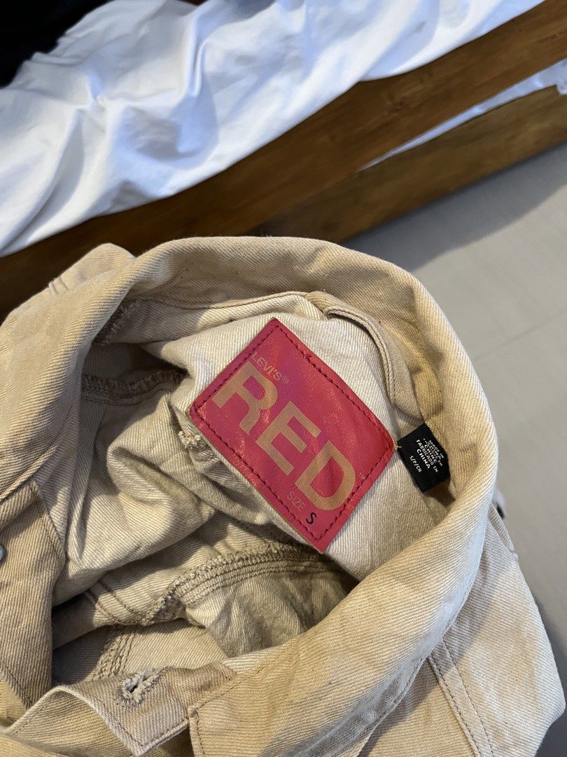 Levi's Red Beige Denim Jacket Size S (Category: Coats, Jackets and Outerwear) located in Quezon City. Submitted by reluxefinds2025 (Listing ID 1468510654, Image 2). Description: - Brand: Levi's Red - Color: Beige - Size: S (Tag: 165/84A / 160 cm) - Material: Denim - Design: Button-up front with classic collar and multiple front pockets - Details: Signature red leather brand patch inside the collar - Origin: Made in China - Condition: Excellent.