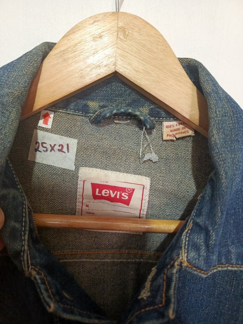LEVI'S TYPE 2 DISTRESSED TRUCKER DENIM JACKET (Category: Coats, Jackets and Outerwear) located in Baguio. Submitted by 074thriftmania (Listing ID 1468601624, Image 3). Description: - Brand: Levi's - Style: Classic denim trucker jacket - Color/Wash: Dark blue wash with stylish intentional distressing and rips - Size: Medium (M) - Material: 100% Cotton - Features: Front button closure and dual chest pockets - Condition: Excellent streetwear staple.