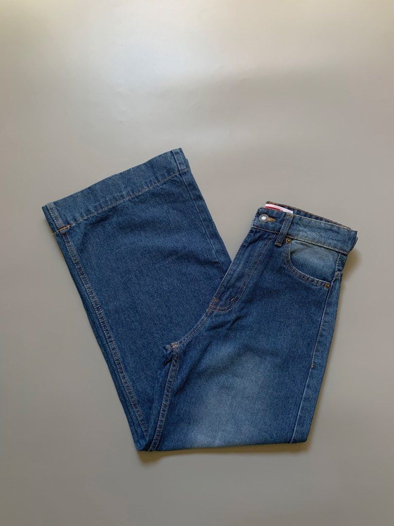 Levi's Wide Leg Denim Jeans (Category: Jeans) located in Manila. Submitted by swift_royalfox.18 (Listing ID 1468659623, Image 1). Description: - Brand: Levi's - Style: Wide leg jeans with flat hem detail - Wash: Classic medium wash denim - Fit: High-waisted with front button closure - Details: Standard five-pocket layout and iconic red label on waistband.
