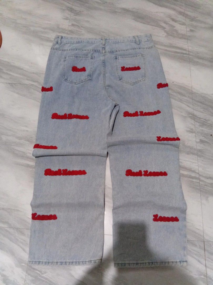 light blue baggy jeans (Category: Jeans) located in Baguio. Submitted by steambunny (Listing ID 1468635399, Image 2). Description: size 37 42 length 12.5 thigh 9.5 hem needs wash embroidered yung design excellent condition no issue no return/exchange.