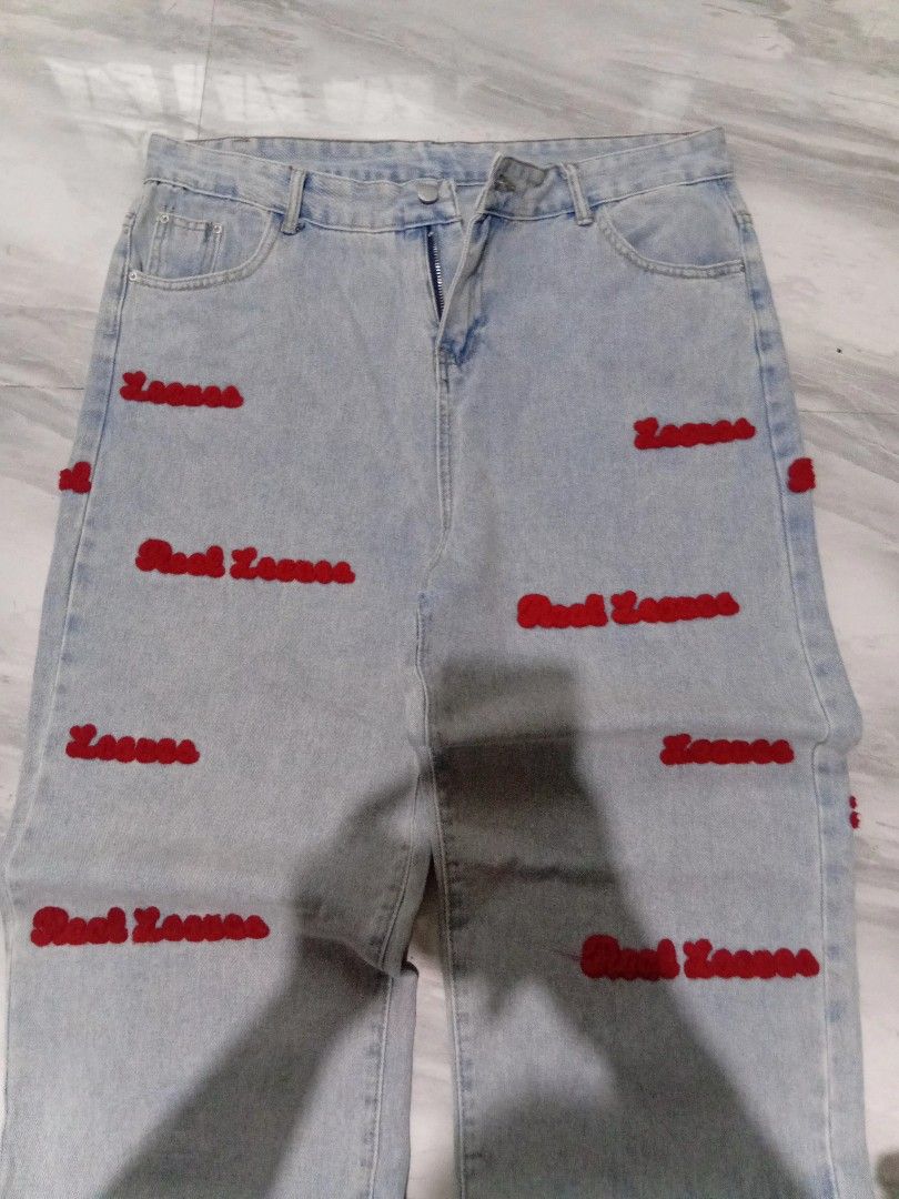 light blue baggy jeans (Category: Jeans) located in Baguio. Submitted by steambunny (Listing ID 1468635399, Image 3). Description: size 37 42 length 12.5 thigh 9.5 hem needs wash embroidered yung design excellent condition no issue no return/exchange.