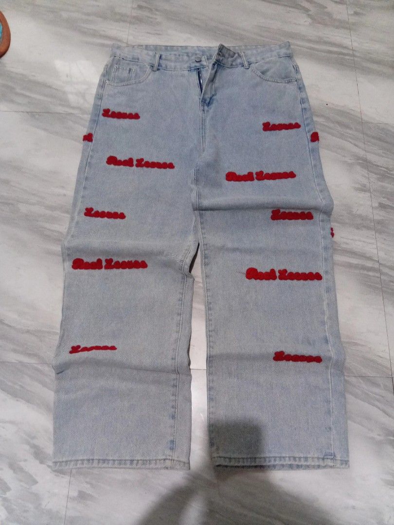 light blue baggy jeans (Category: Jeans) located in Baguio. Submitted by steambunny (Listing ID 1468635399, Image 1). Description: size 37 42 length 12.5 thigh 9.5 hem needs wash embroidered yung design excellent condition no issue no return/exchange.