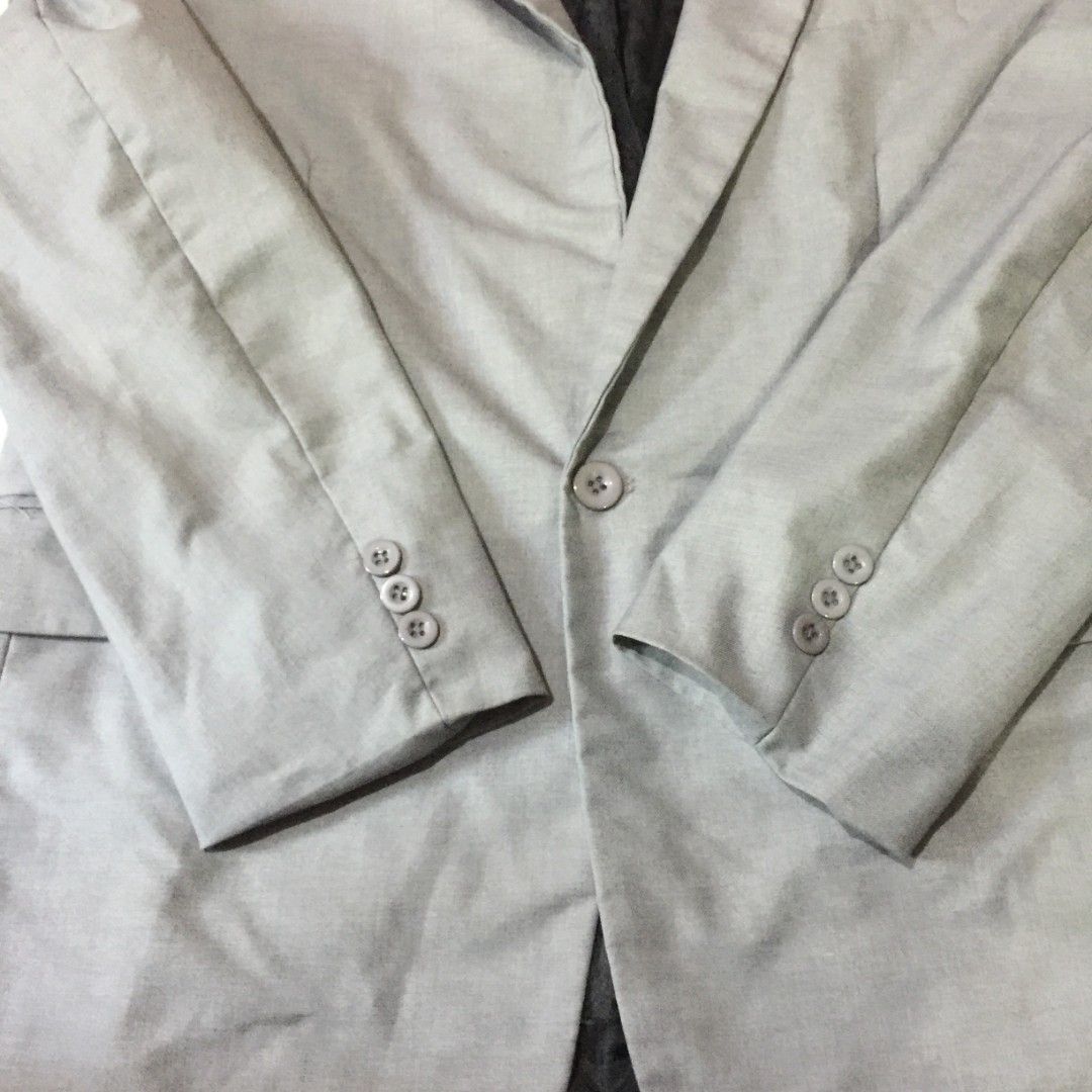 Light Gray Single-button Suit Jacket Blazer / Corporate Blazer (Category: Coats, Jackets and Outerwear) located in Pasig City. Submitted by butfirst.declutter (Listing ID 1468577324, Image 3). Description: - Like new. No issue - All front pockets are design only - Fits L-XL men (2XL on tag) - Single front button closure - Complete buttons - Color may vary due to lighting - See photos for measurements - Manage your expectations since this is a pre