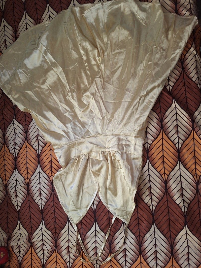 Light Yellow Satin Halter Mini Dress (Category: Dresses) located in Manila. Submitted by bitna44 (Listing ID 1468561106, Image 1). Description: - Color & Material: Light yellow silky satin that catches the light - Design: Halter neck with adjustable sliders, flared skirt with great movement, and a back zipper closure - Fit: Built-in waist ties for an adjustable and flattering fit - Versatility: Ideal for parties, clubwear, or a stylish summer nig