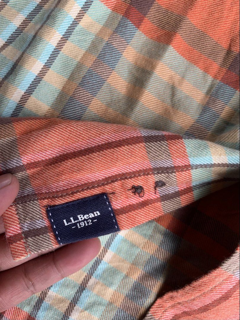l.l.bean Plaid Long Sleeve Button-Down Shirt Medium (Category: Longsleeves) located in Naga. Submitted by than09070539101 (Listing ID 1468520054, Image 2). Description: - Brand: L.L.Bean - Style: Plaid button-down shirt with contrasting inner collar lining - Colorway: Orange and teal tones - Size: Medium (Slightly fitted cut) - Material: 52% Organic cotton, 48% Tencel lyocell - Features: Long sleeves, dual front chest pockets, branded brown butto