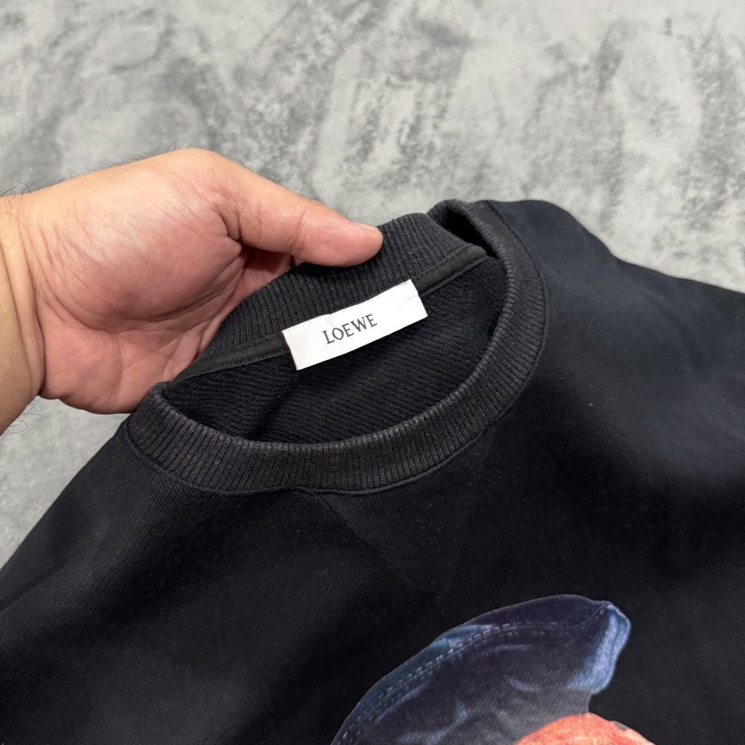 LOEWE LONG SLEEVE (Category: Luxury Apparel) located in Santa Maria. Submitted by rarefindslt (Listing ID 1468680324, Image 3). Description: LOEWE BLACK DOG SWEATSHIRT (SWIPE LEFT FOR MORE DETAILS..) L on tag in solid black condition color rate! with tags for authenticity, long sleeve french terry sweatshirt in black. Rib knit crewneck collar, cuffs, and hem. Raw edge at armscyes, front dog-patch and script print design , cotton sweatshirt, can p