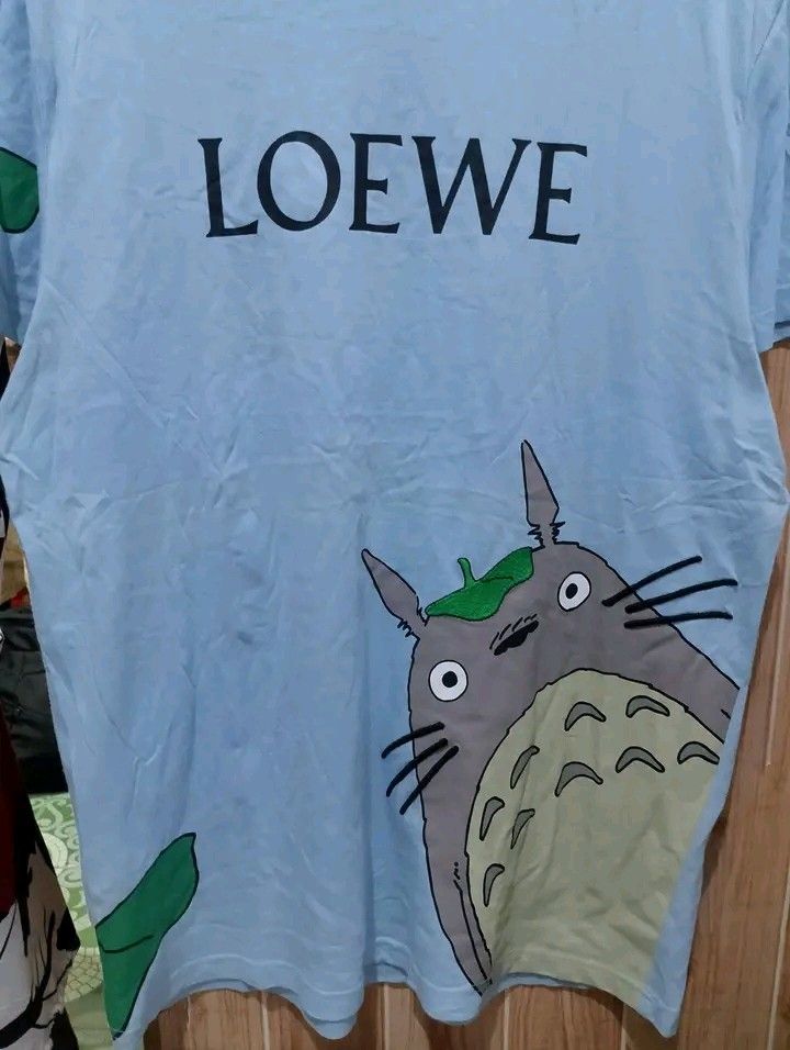 LOEWE STUDIO GHIBLI (Category: Tshirts & Polo Shirts ) located in Taguig. Submitted by clothingselection (Listing ID 1468661249, Image 3). Description: PTPA LOEWE STUDIO GHIBLI 22 X 30 VERYGOOD CONDITION NID WASH FRESH FROM BALE MAY YELOW LINE SA GITNA OR BETTER IF NA WASH NOT VISIBLE.
