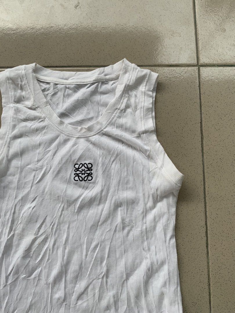 Loewe tank top (Category: Blouses) located in Cotabato. Submitted by clarence0918 (Listing ID 1468656595, Image 2). Description: Good as new no issue 10/10 color rate 12x21 washed.